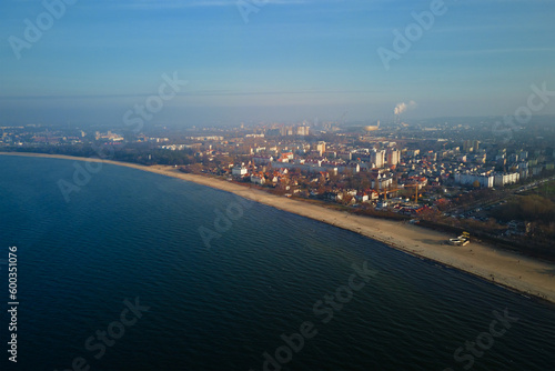 Sea shore with view of Gdansk city, aerial view. Baltic Sea in Poland. Beautiful natural landscape with sea beach coastline