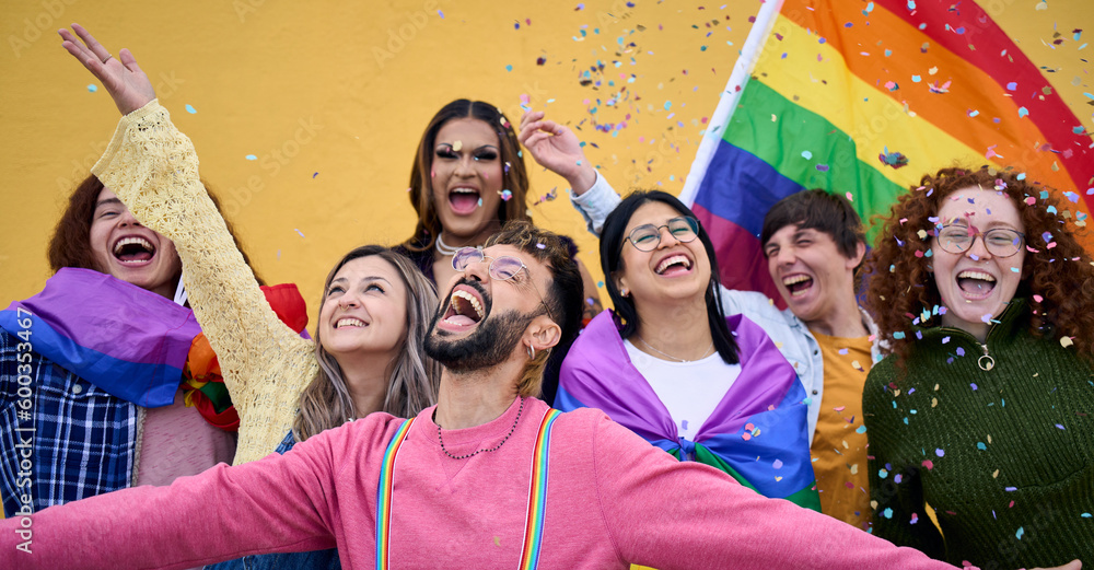 Excited young friends of LGBT community celebrating gay pride day festival. Group of diverse joyful cheerful people having fun together under shower of confetti. Generation z and social event.  - obrazy, fototapety, plakaty 