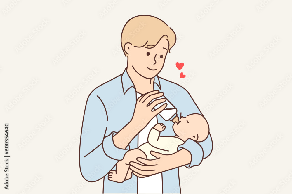 Man feeds newborn baby experiencing fatherly love for baby for concept of equal parenting Man feeds newborn baby experiencing fatherly love for baby for concept of equal parenting