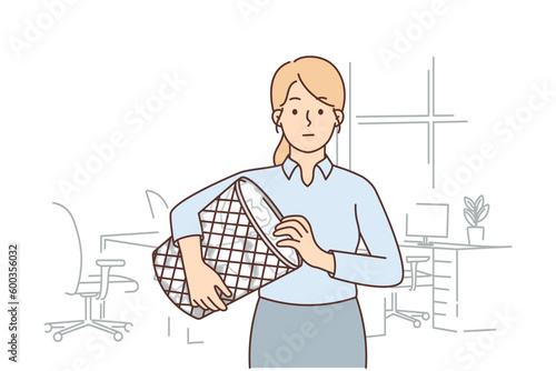 Woman secretary with trash can filled with crumpled paper is looking for lost document