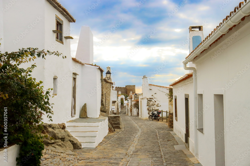 Monsaraz town in Portugal by the riverside - a street with white houses