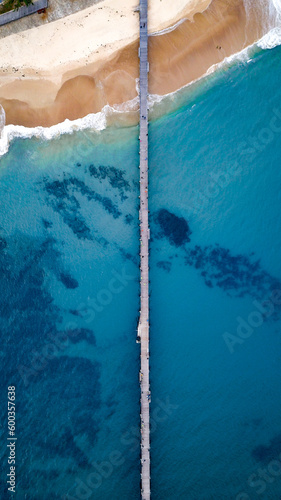 Jetty over blue water 