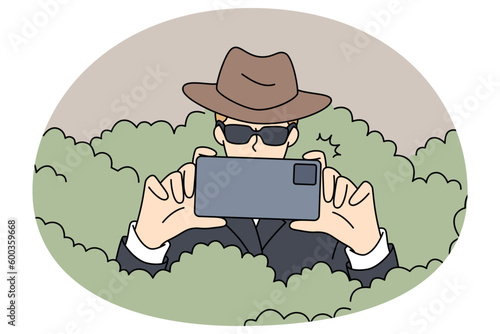 Private detective in sunglasses hiding in bushes photographing using smartphone camera. Spy or secret agent making photo with cellphone solving or detecting crime. Vector illustrations.
