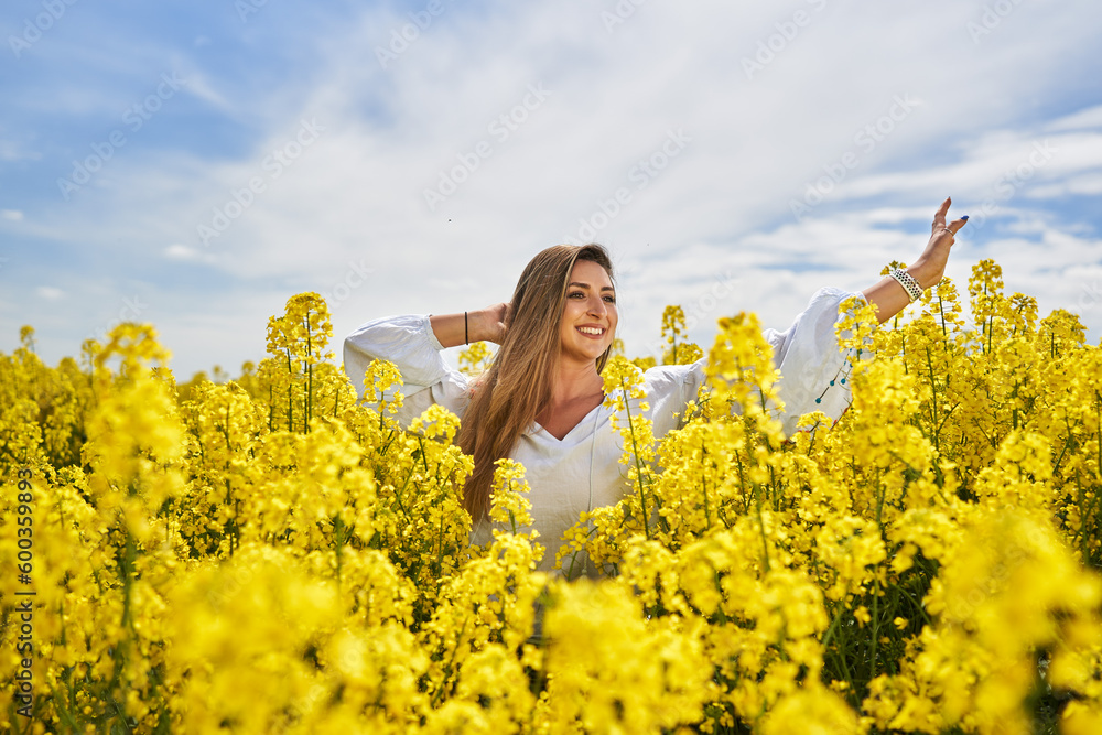 Beautiful blonde latino woman in a canola field Beautiful blonde latino woman in a canola field