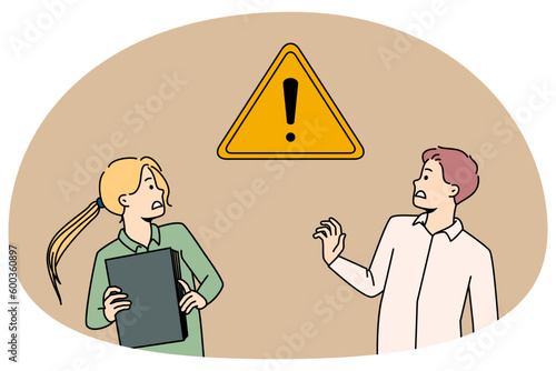 Valokuva Scared businesspeople frustrated with exclamation warning sign