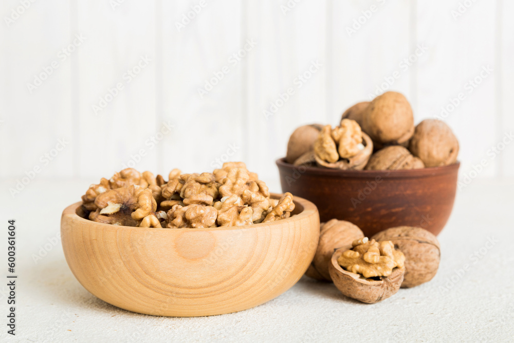 Fresh healthy walnuts in bowl on colored table background. Top view Healthy eating bertholletia concept. Super foods Fresh healthy walnuts in bowl on colored table background. Top view Healthy eating bertholletia concept. Super foods