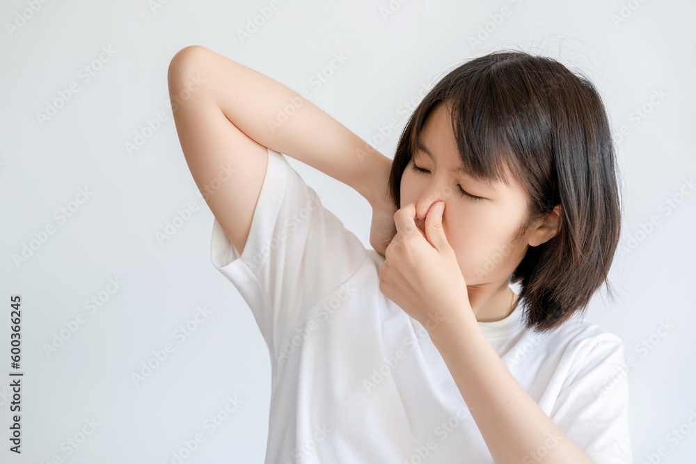 Woman sweating under armpit because of hot weather. Woman sweating under armpit because of hot weather.