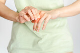 Woman finger joint pain due to arthritis. Concept of health problems.