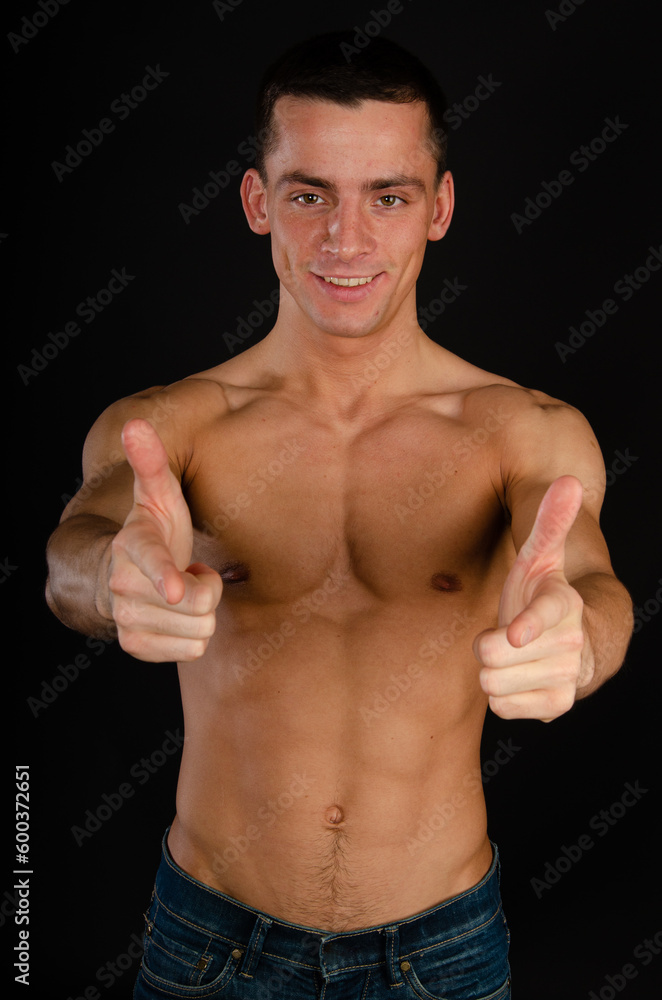 Young attractive man posing in the studio. Young attractive man posing in the studio.