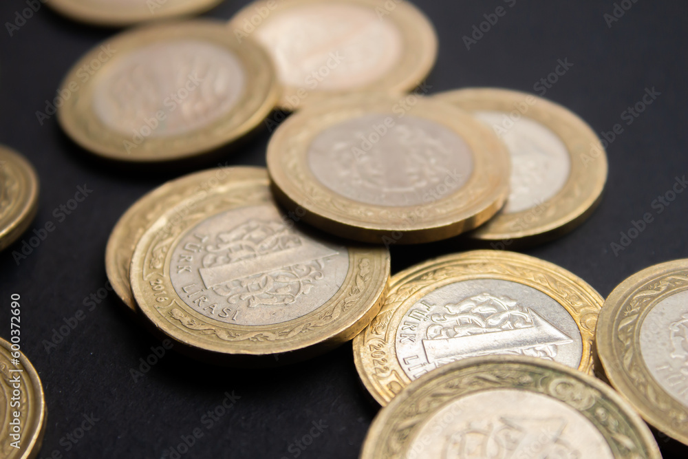 Turkish lira coins on black background. Closeup photo of Turkish coin moneys. Turkish lira coins on black background. Closeup photo of Turkish coin moneys.