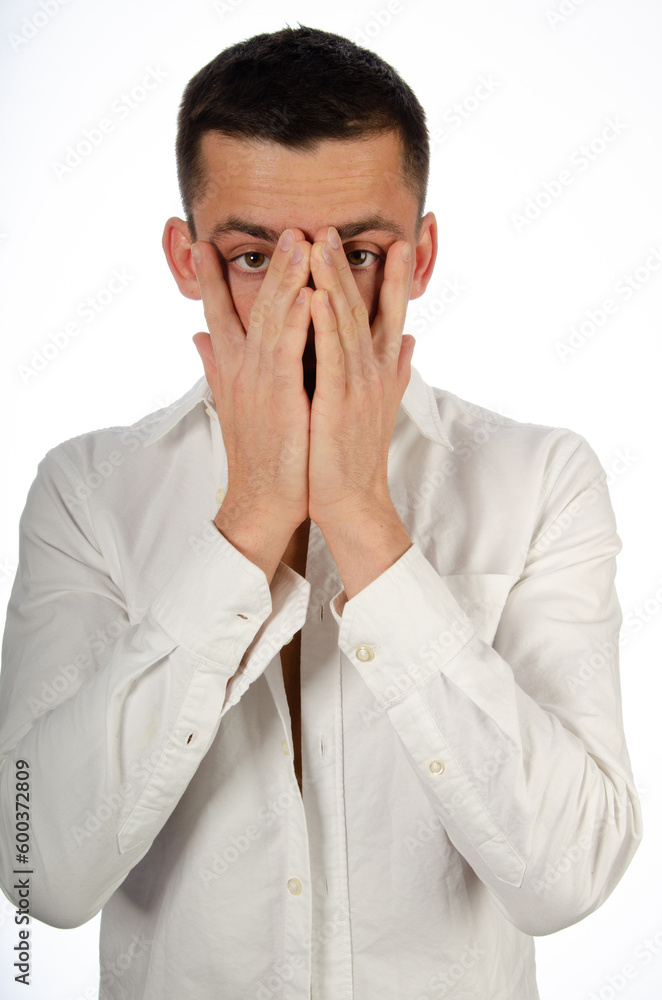 Young attractive man is crying and posing in the studio. Young attractive man is crying and posing in the studio.