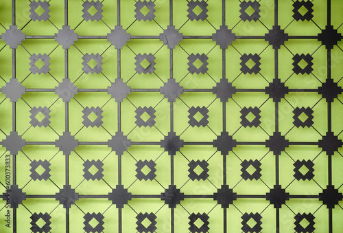 Decorative laser cut at metal wall with green color wall background, Interior detail