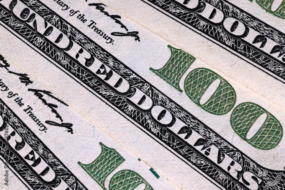 close-up of a group of one hundred American dollars close-up of a group of one hundred American dollars
