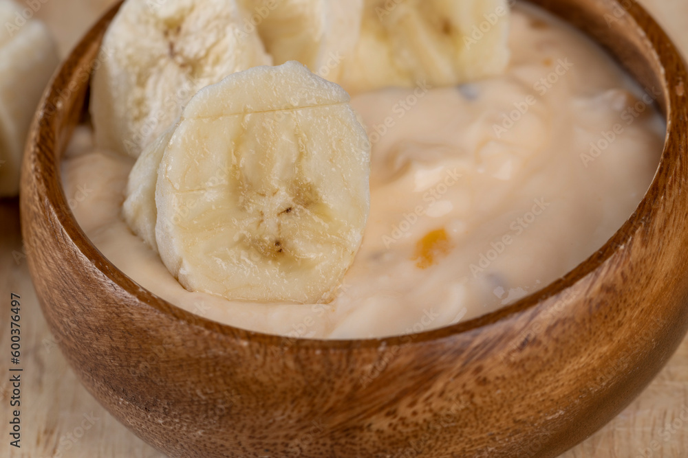 fresh banana-flavored yogurt with banana slices fresh banana-flavored yogurt with banana slices