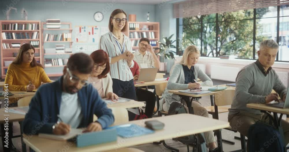 Multiethnic Women and Men of Different Age Acquiring New Academic Skills in Classroom. Formal Adult Learning Activity, Undertaken by Diverse Mature Students After Finishing School and College Multiethnic Women and Men of Different Age Acquiring New Academic Skills in Classroom. Formal Adult Learning Activity, Undertaken by Diverse Mature Students After Finishing School and College