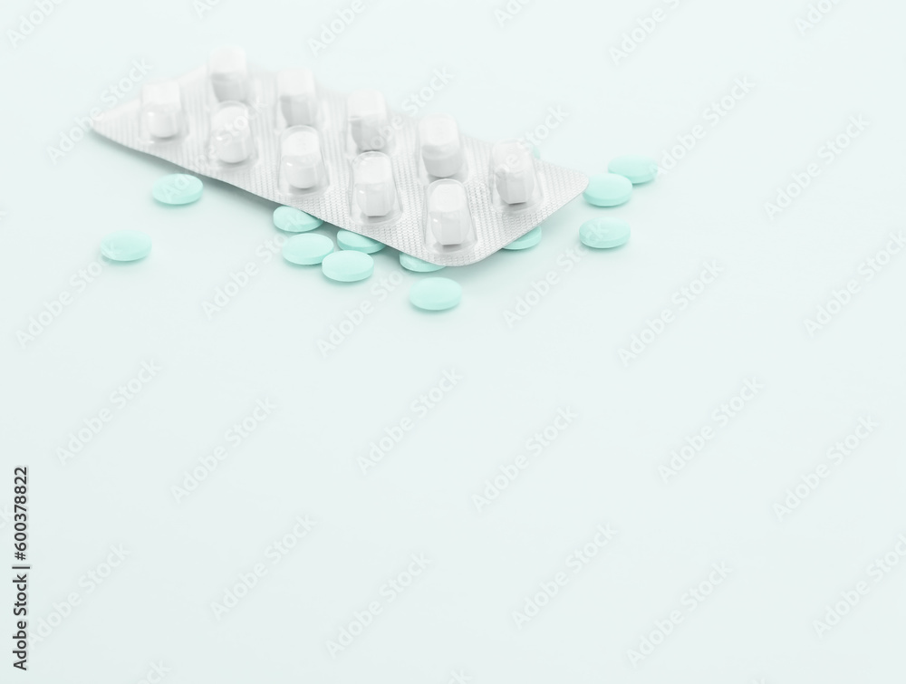 Pills on blue background. Medical pharmacy design.