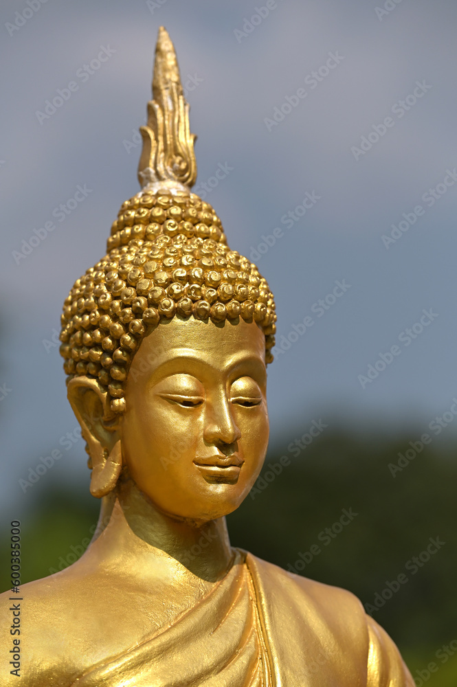 face of golden buddha in buddhism sky nature scene