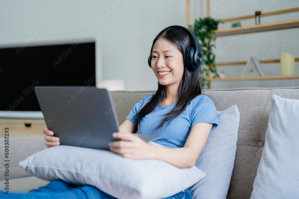 Home lifestyle woman relaxing sleeping on sofa patio living room. Happy lady lying down on comfortable pillows taking a nap for wellness and health. Tropical vacation. Home lifestyle woman relaxing sleeping on sofa patio living room. Happy lady lying down on comfortable pillows taking a nap for wellness and health. Tropical vacation.