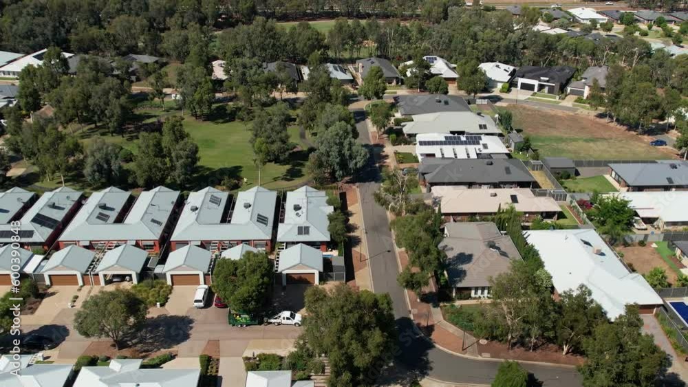 Yarrawonga, Victoria, Australia - 31 January 2023: Pan along a suburban street with a park and trees in the background Yarrawonga, Victoria, Australia - 31 January 2023: Pan along a suburban street with a park and trees in the background
