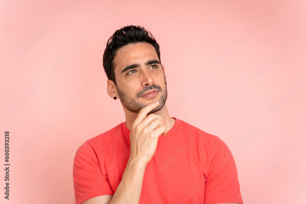 Thoughtful man looking away in studio shot. Thoughtful man looking away in studio shot.