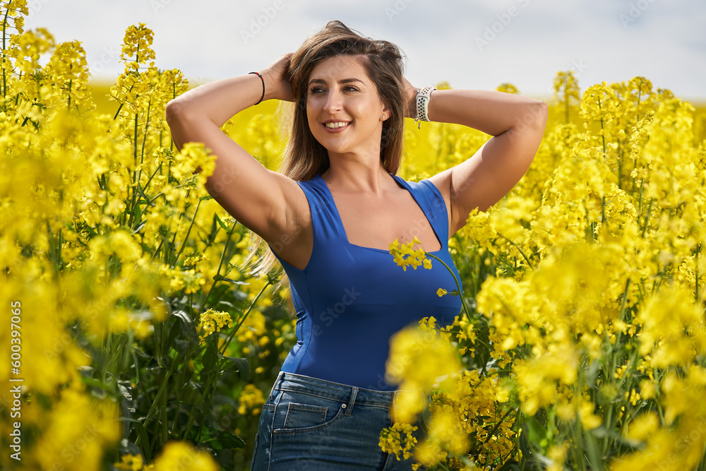 Attractive blonde latino woman in canola field Attractive blonde latino woman in canola field