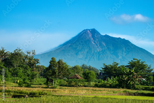 View of Mount Merapi Volcano erupting, Yogakarta region, Central Java, Indonesia. The active lava flows and smoke can be seen on the left flank,
