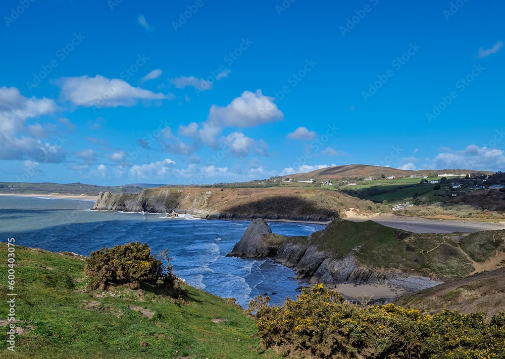 Three Cliffs Bay, a popular tourist destination located on the south coast of the Gower Peninsula in Wales.