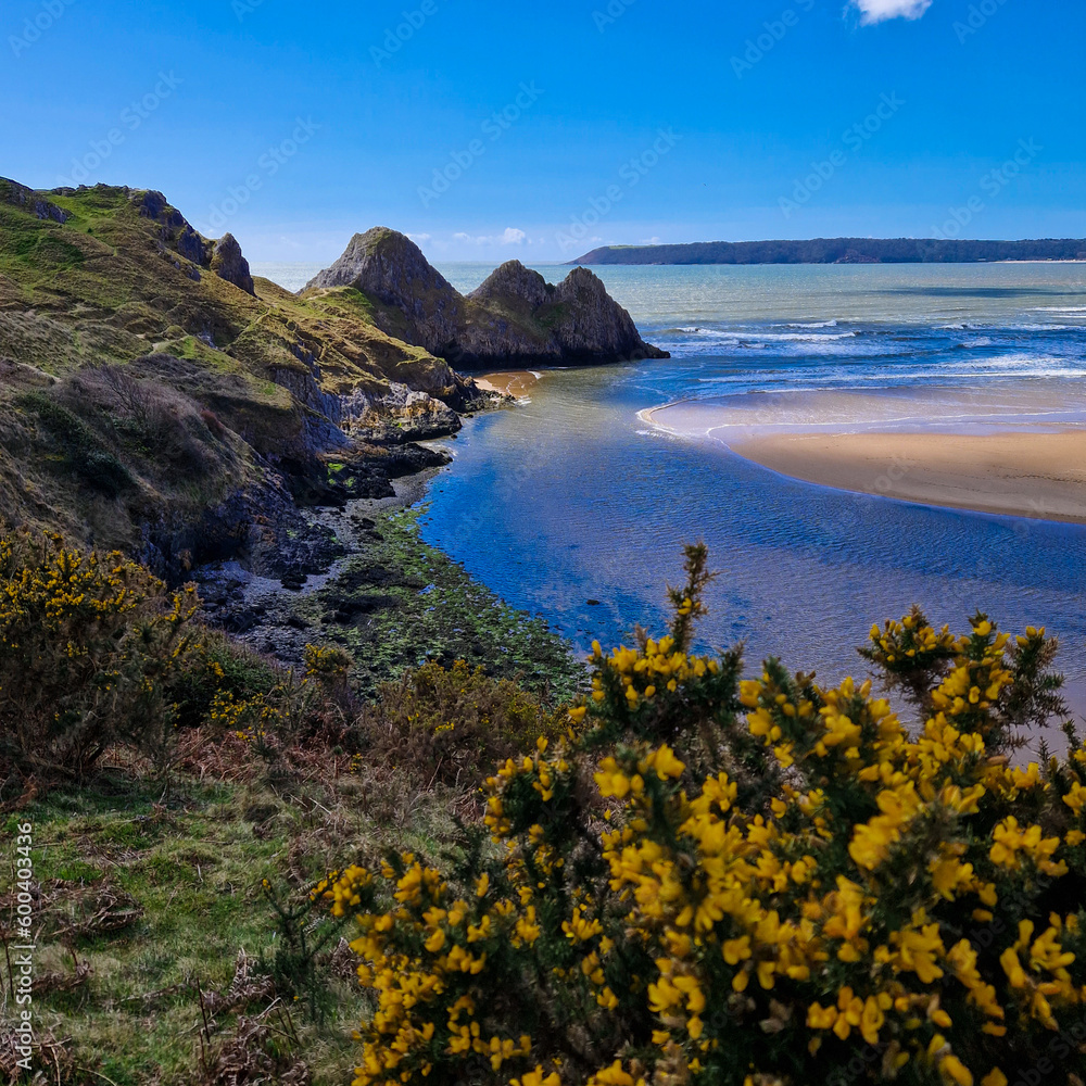 Three Cliffs Bay, a popular tourist destination located on the south coast of the Gower Peninsula in Wales.