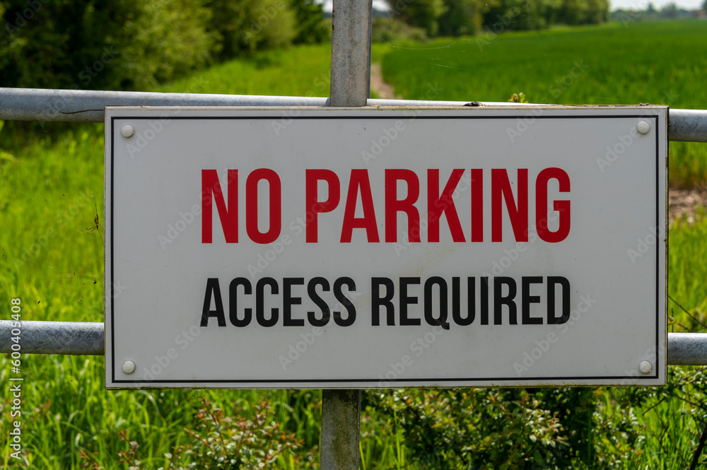No parking access required sign on a gate to a field No parking access required sign on a gate to a field