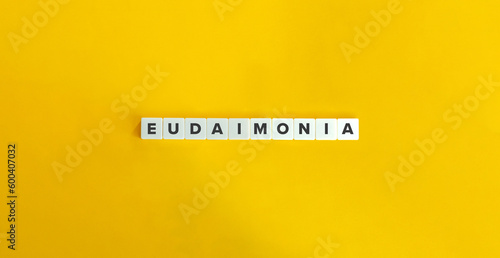 Eudaimonia or Eudaemonia (Good Spirit) Banner. Letter Tiles on Yellow Background. Minimal Aesthetics.