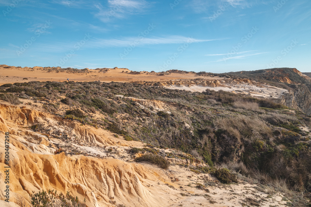 Lunar, dry landscape with crumbling limestone and sandy surface in the Odemira region, western Portugal. Wandering along the Fisherman Trail, Rota Vicentina