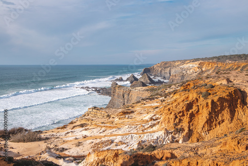 Lunar landscape with steep cliffs on the Atlantic coast in the Odemira region, western Portugal. Wandering along the Fisherman Trail, Rota Vicentina