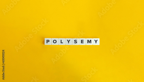 Polysemy Word on Letter Tiles on Yellow Background. Minimal Aesthetics. photo