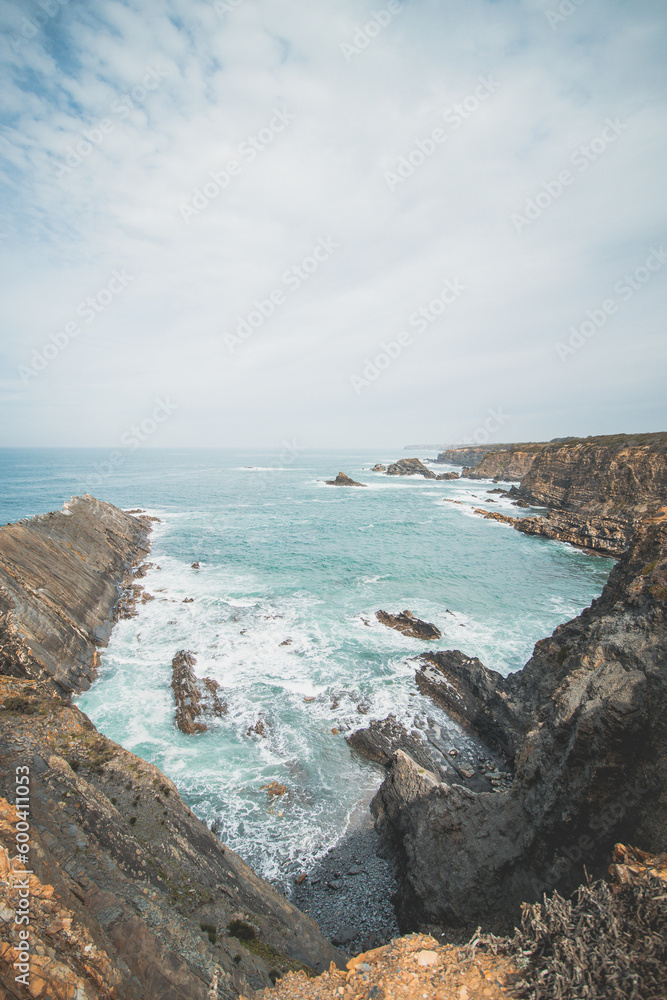 View of the rocky outcrops rising from the Atlantic Ocean in Zambujeira do Mar, Odemira region, western Portugal. Wandering along the Fisherman Trail, Rota Vicentina