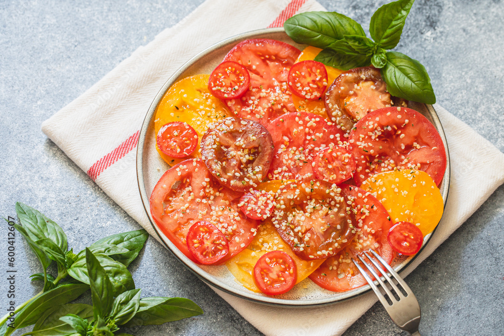 tomato salad with hemp seeds. healthy food concept with superfoods tomato salad with hemp seeds. healthy food concept with superfoods