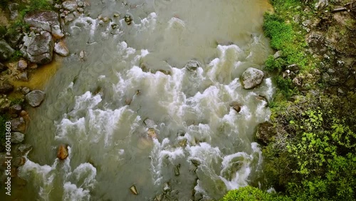 River water splashing on rocks, aerial view photo