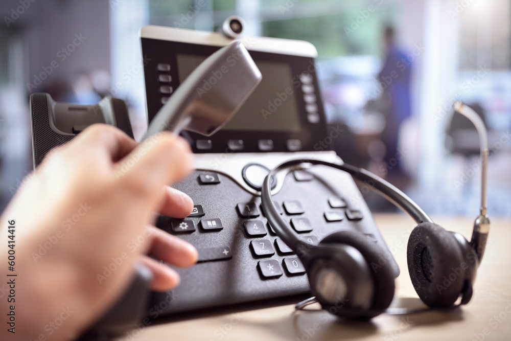 Headset headphones and dialing a telephone in call center office concept for communication, contact us and customer service support - obrazy, fototapety, plakaty 