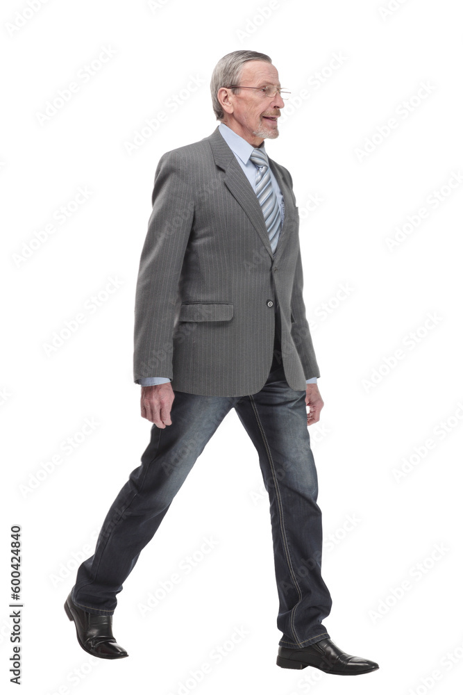 full length picture of a mid aged business man walking towards the camera and smiling. full length picture of a mid aged business man walking towards the camera and smiling.