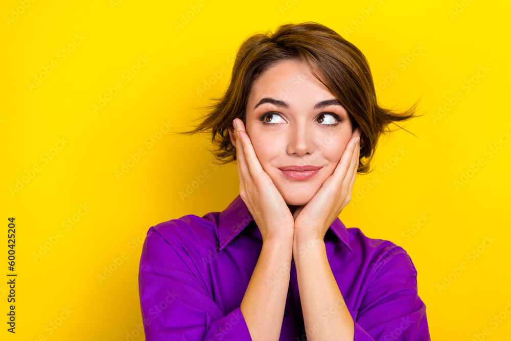 Photo portrait of pretty young girl palms touch cheeks wear trendy violet smart casual outfit isolated on yellow color background Photo portrait of pretty young girl palms touch cheeks wear trendy violet smart casual outfit isolated on yellow color background