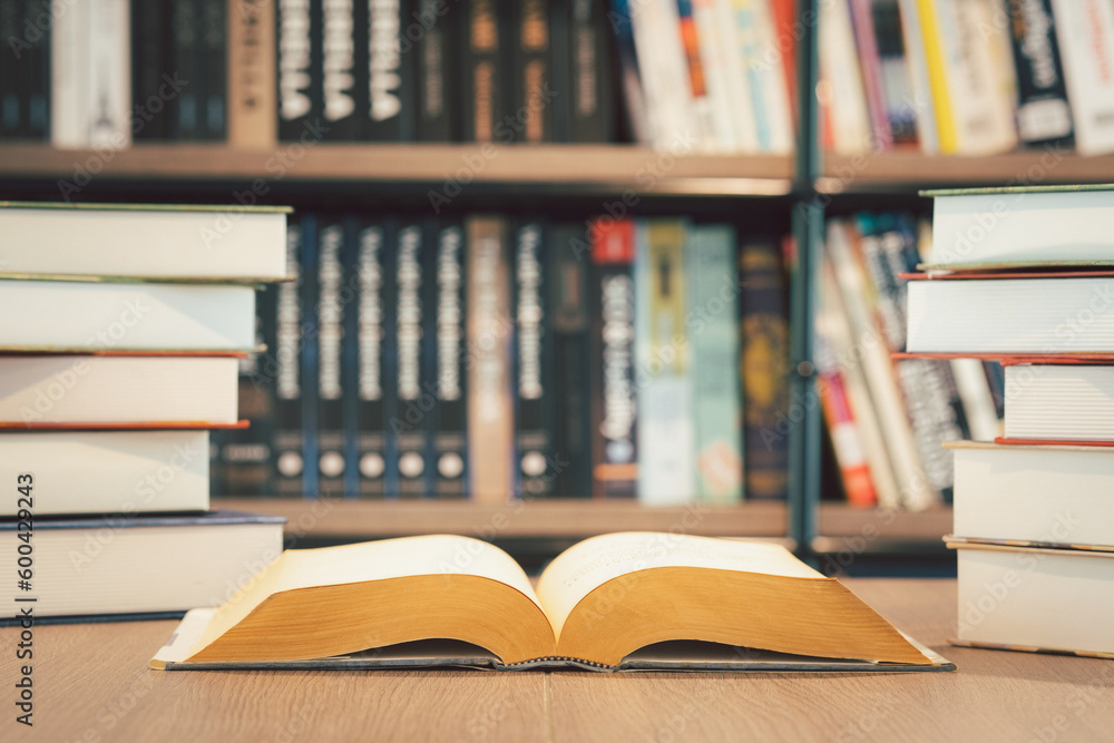 Open book on the table in library. Love read a book. Education learn and knowledge concept. Student study in school or university. Open book on the table in library. Love read a book. Education learn and knowledge concept. Student study in school or university.