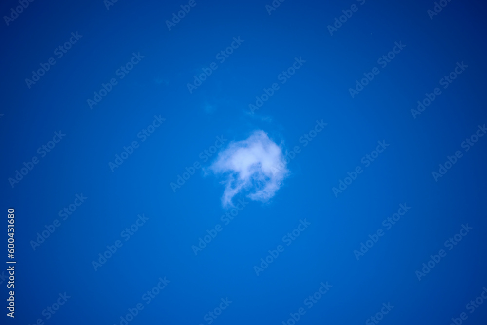 Fototapeta premium landscape with a small cloud on the blue background