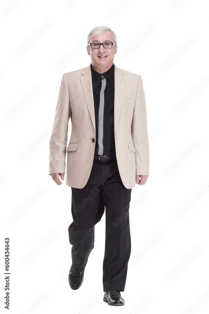 intelligent mature man in a white jacket walking forward . intelligent mature man in a white jacket walking forward .