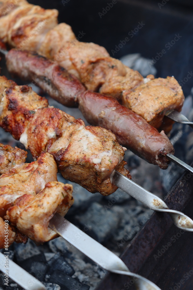 juicy pork meet is roasted on the fire in the grill juicy pork meet is roasted on the fire in the grill
