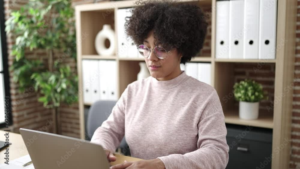 Young african american woman business worker using laptop working at office