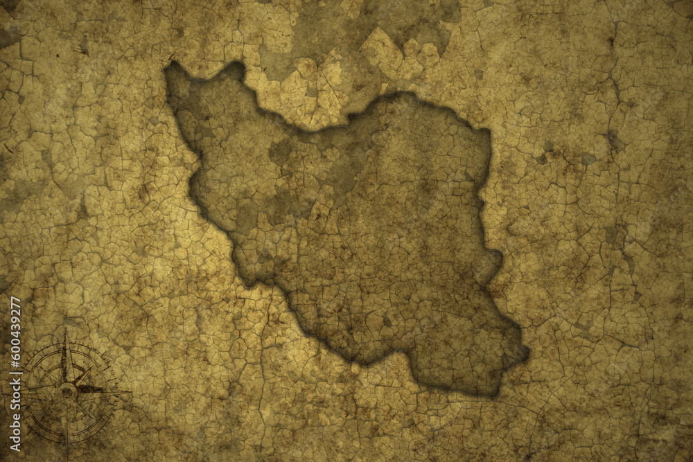 map of iran on a old vintage crack paper background .