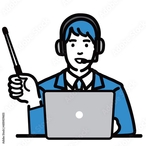ラップトップの前に座って指し棒で解説しているオペレーターの若い男性
