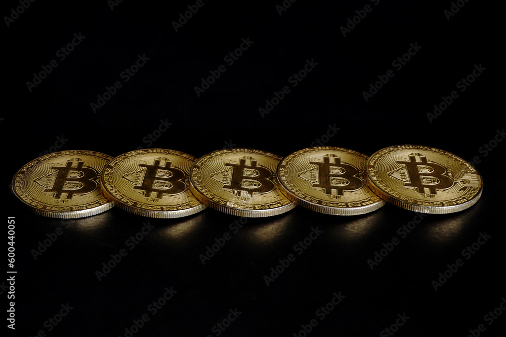 gold bitcoin on back background