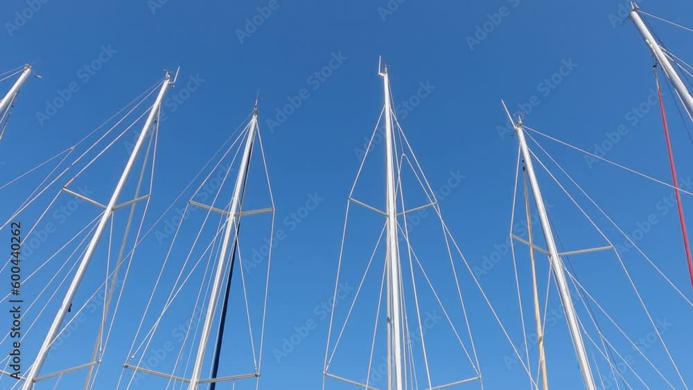 Mast detail of top of sail yacht boats anchored in port during summer vacation, travel concept Mast detail of top of sail yacht boats anchored in port during summer vacation, travel concept