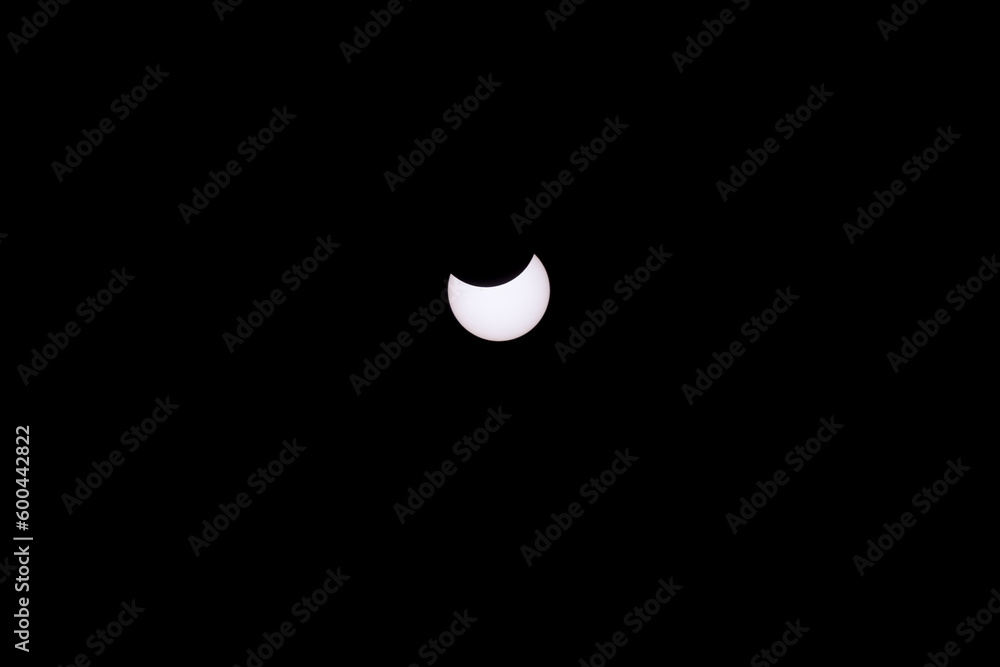 hybrid solar eclipse, Exmouth, Australia, 20.04.2023, approximately one third part of the sun´s surface is covered from the moon during the beginning of the solar eclipse, nightscape, night full of st hybrid solar eclipse, Exmouth, Australia, 20.04.2023, approximately one third part of the sun´s surface is covered from the moon during the beginning of the solar eclipse, nightscape, night full of st