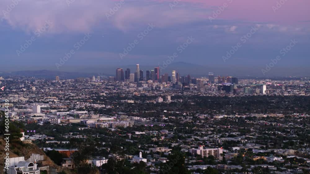 Aerial Panning Shot Of City With Skyscrapers Against Cloudy Sky At Dusk, Drone Flying Over Cityscape - Los Angeles, California Aerial Panning Shot Of City With Skyscrapers Against Cloudy Sky At Dusk, Drone Flying Over Cityscape - Los Angeles, California